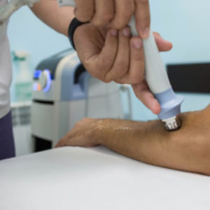 Shockwave therapy treating tennis elbow